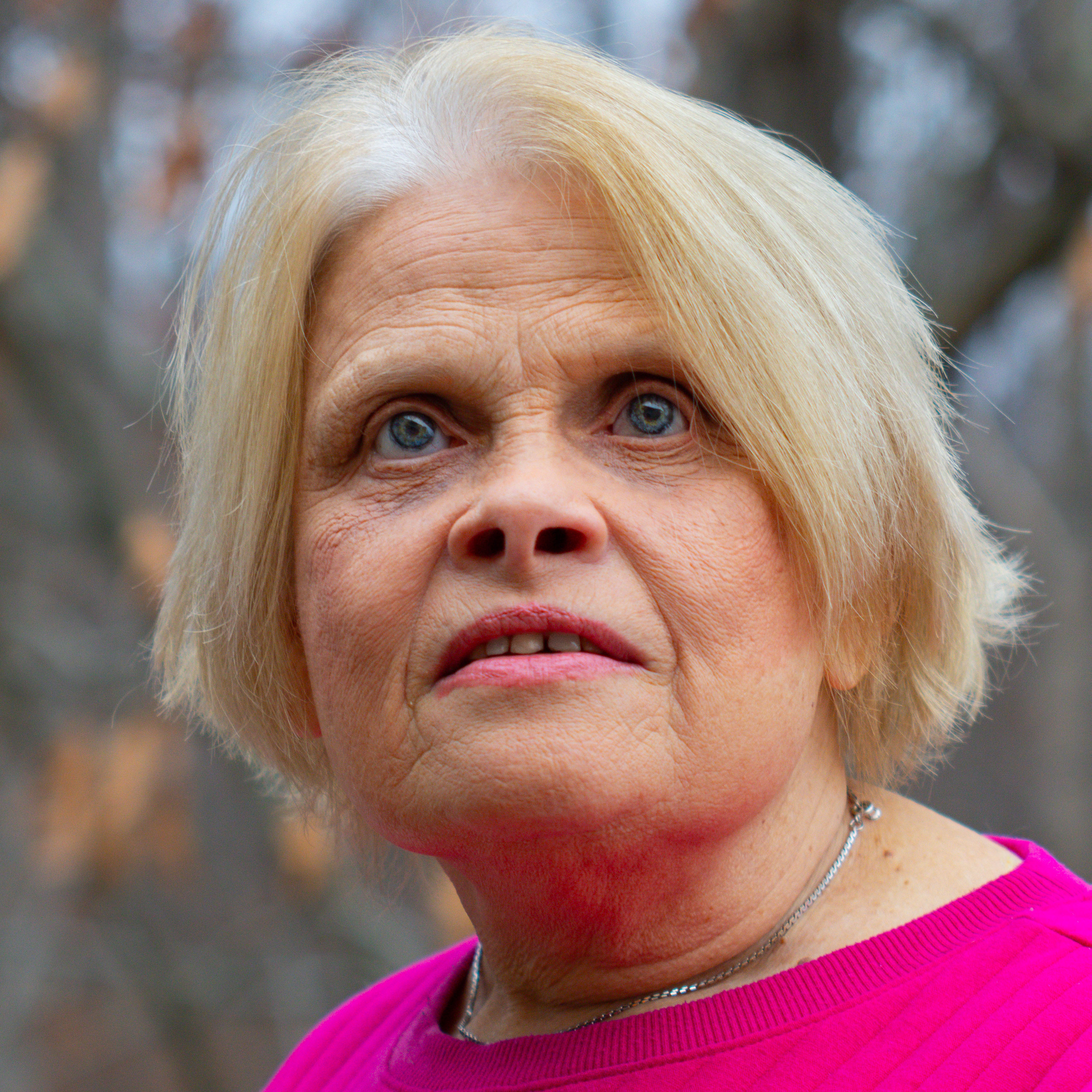 Myself, a blonde woman, wearing a pink shirt.